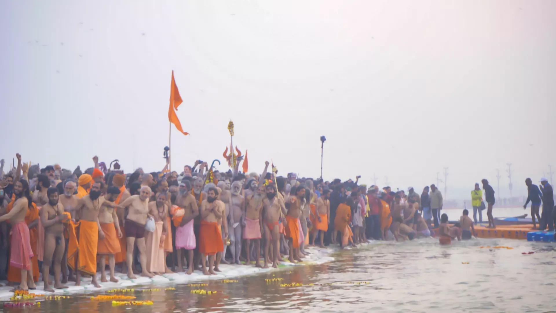 People celebrating MahaKumbh Mela festival on bank of water