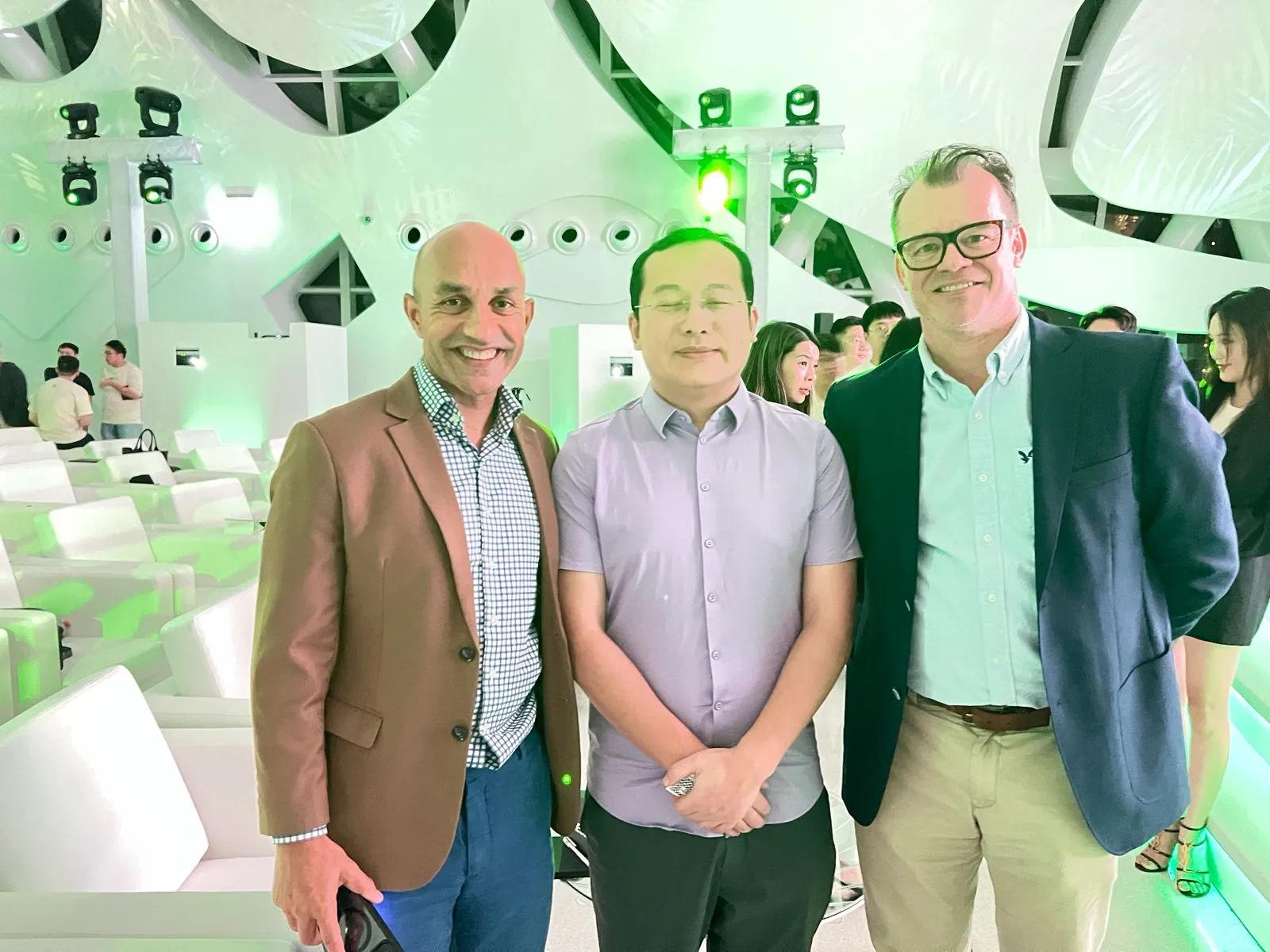 OKX founder Mingxing "Star" Xu beside The Crypto Radio team