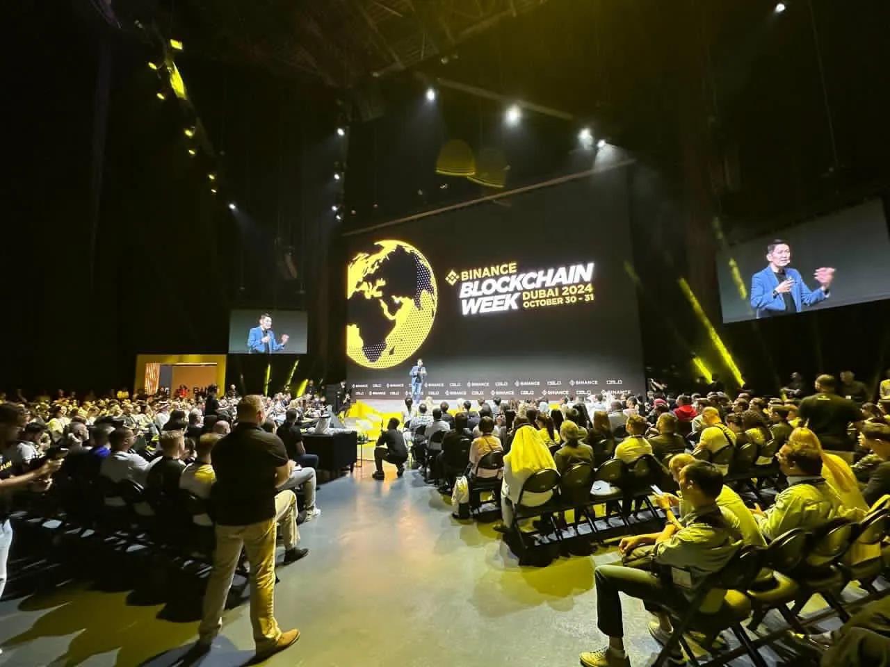 Binance CEO Richard Teng on stage at Binance Blockchain Week in Dubai 2024, with crowd