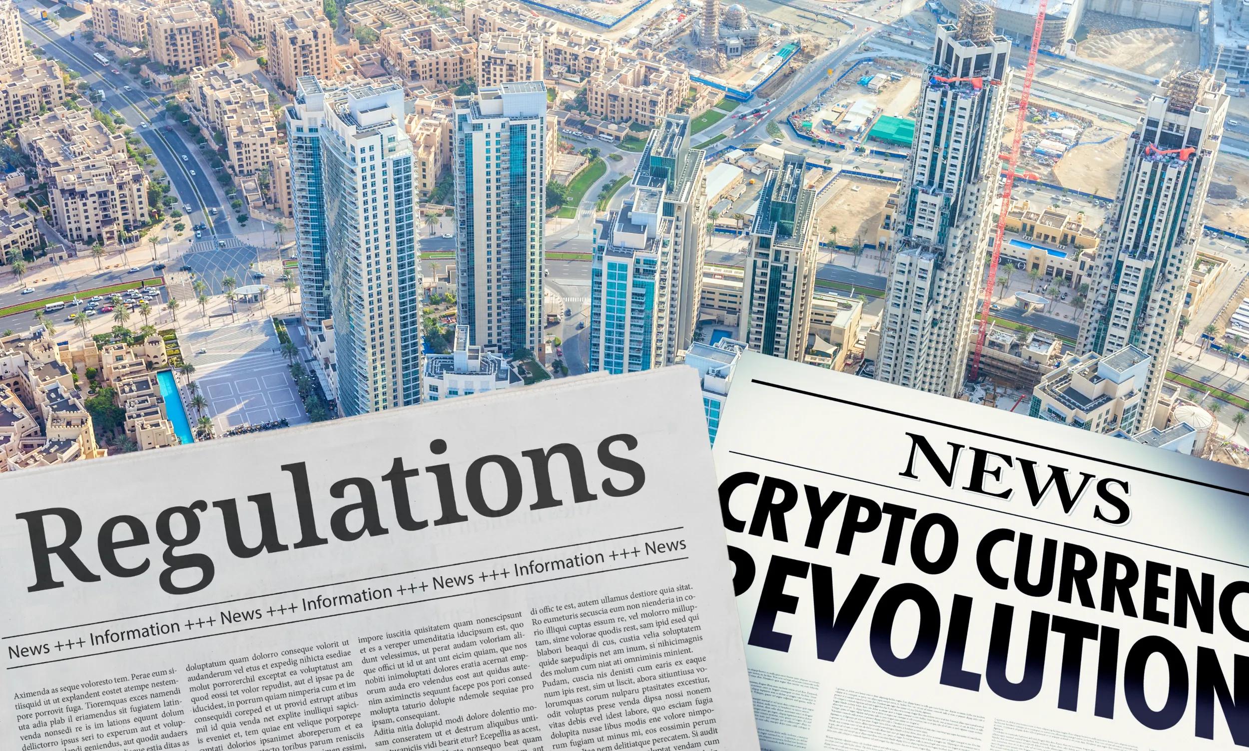 Two newspapers in front of the Dubai cityscape