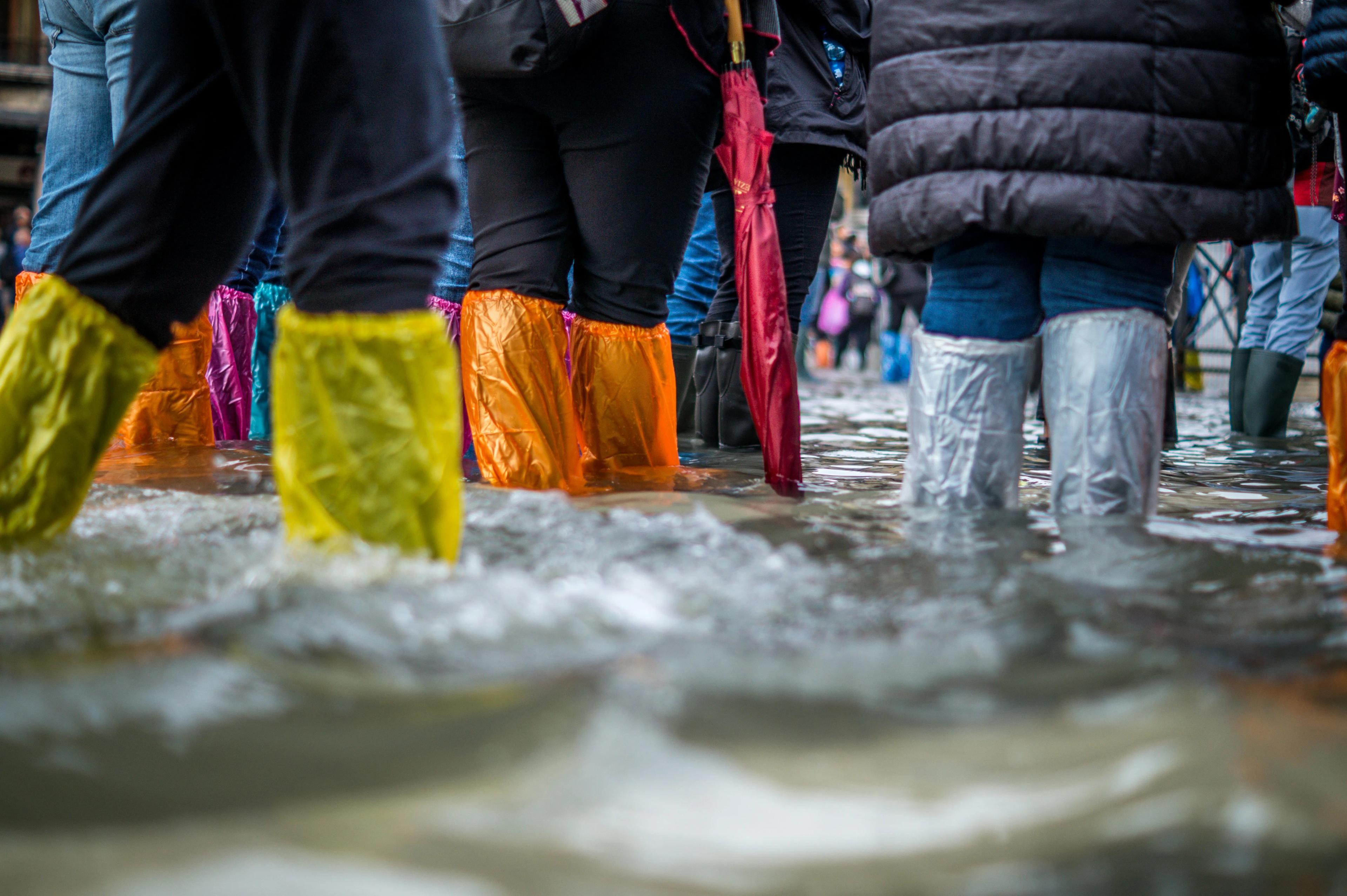 People standing in flood water